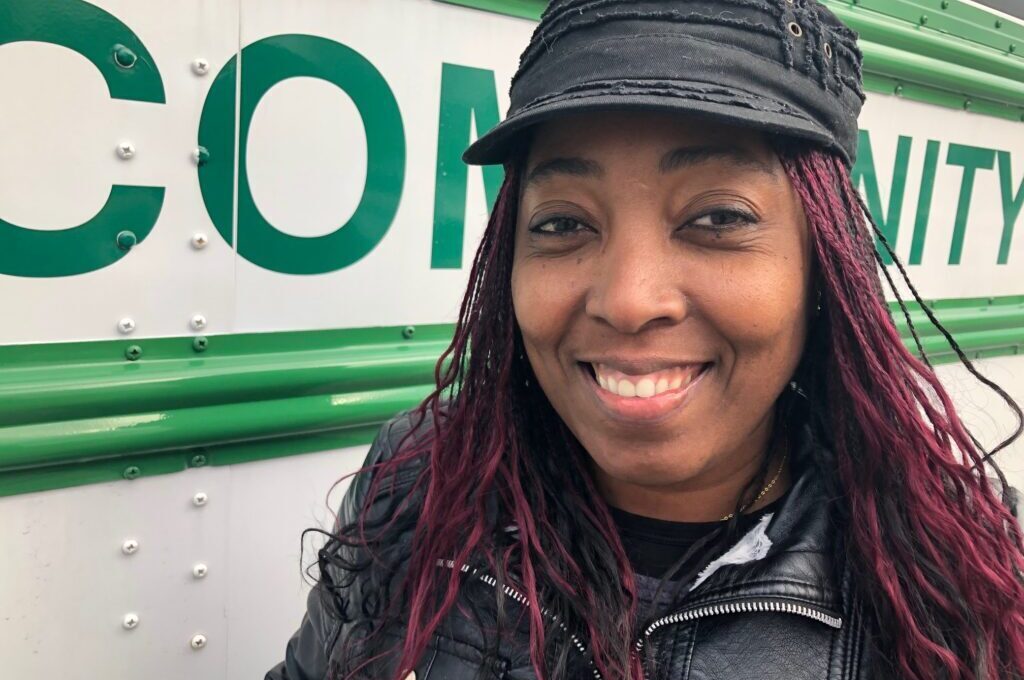 Iveth Callender in front of a truck
